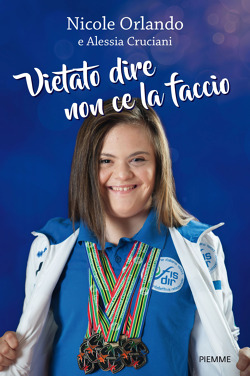 foto di Nicole con uniforme sportiva e medaglie al collo